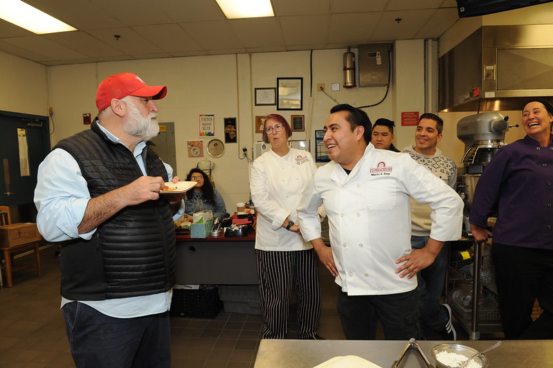 Chef Jose Andres sampling food