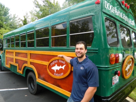 Sam Petrella standing next to Dogfish Head Ale Bus
