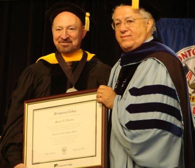 Dr. Stewart Edelstein (left) and Leslie Levine, Montgomery College Board of Trustees, and member of the USG Board of Advisors, at MC Commencement.