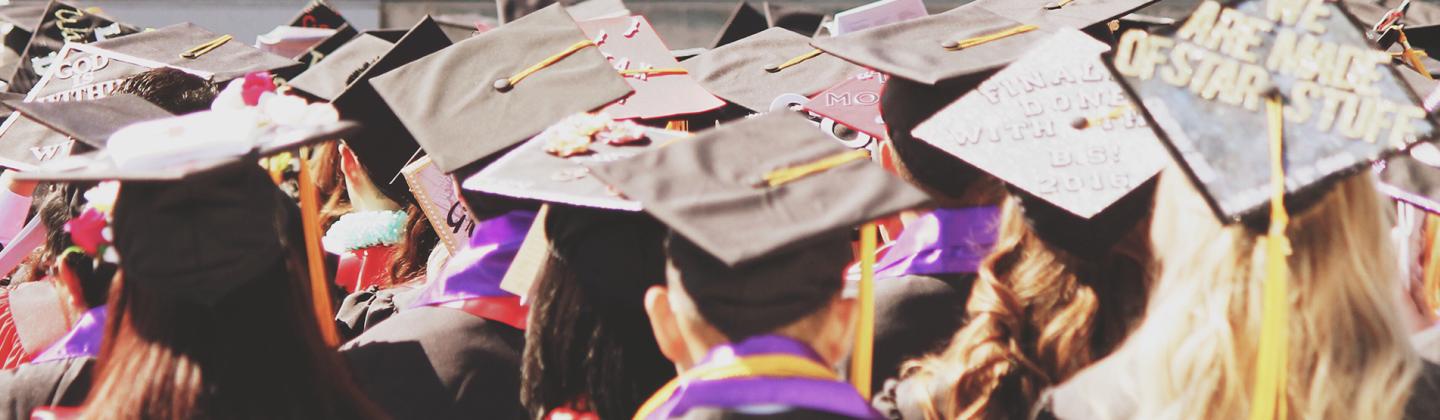College graduates in cap and gown