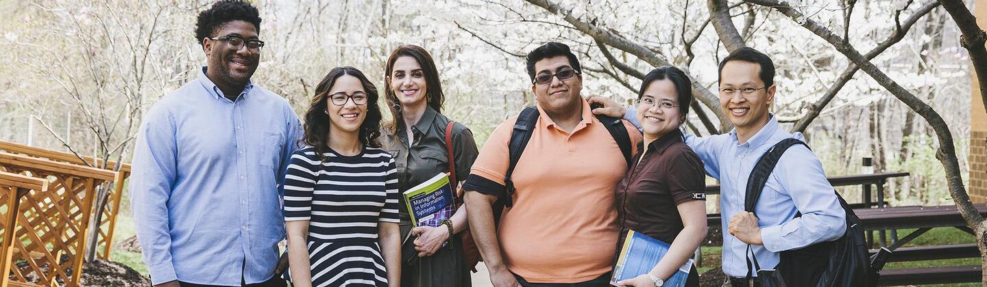 Group of people smiling for the camera