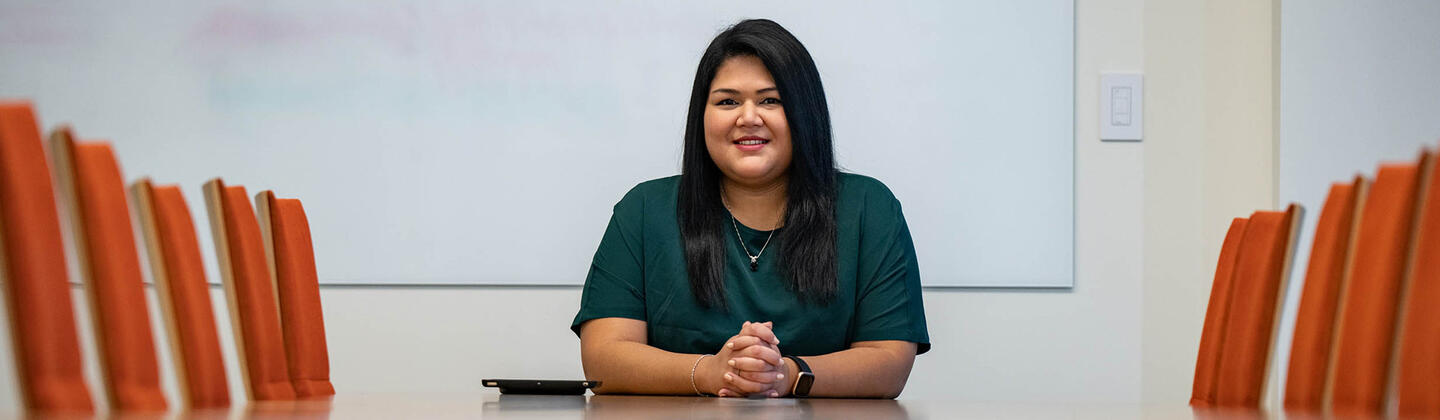 Graduate student sitting in conference room