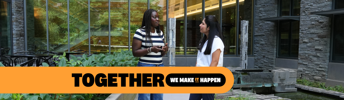 Student and counselor standing outside