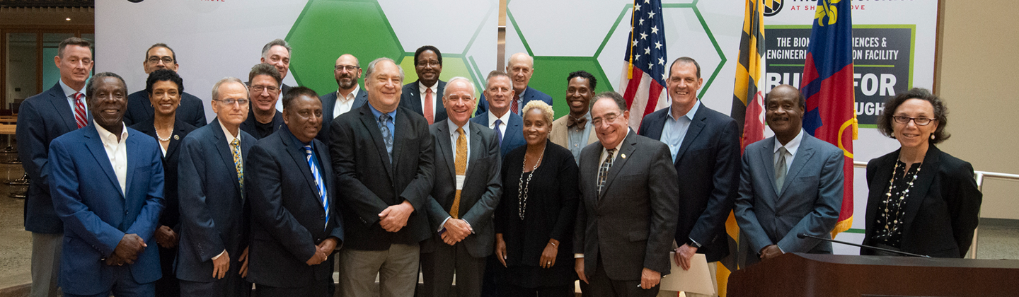 Photo of Dr. Khademian at MOU signing event with county officials